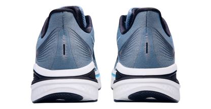 Blue running shoes with white soles on a white background