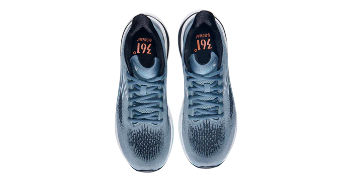 Pair of blue athletic shoes with visible brand logo on a white background
