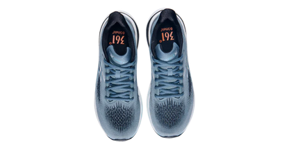 Pair of blue athletic shoes with visible brand logo on a white background