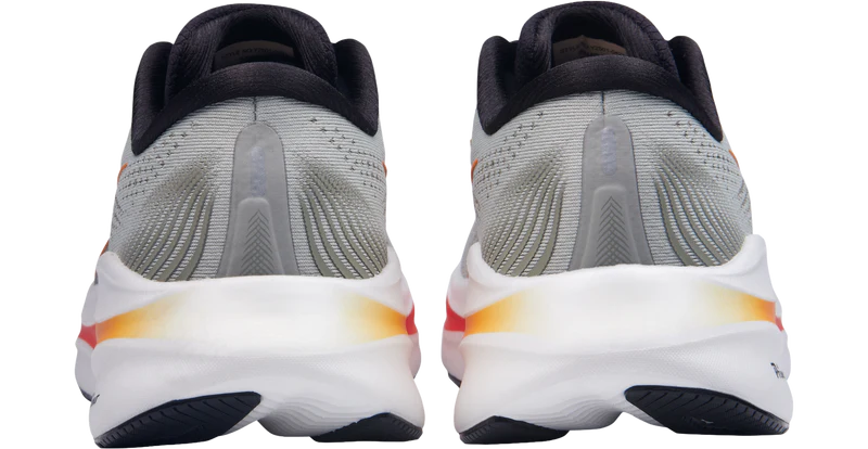 Gray running shoes with white soles on a white background