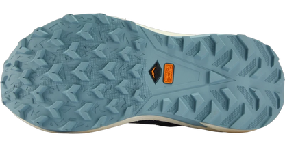 Close-up of the outsole of a trail running shoe in a dusty blue-gray color, showing the tread pattern and a small orange and black Apex Grip logo near the heel.