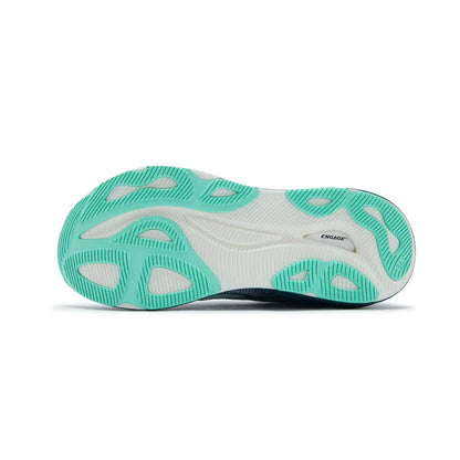 Sole of a shoe with green and white design on a white background