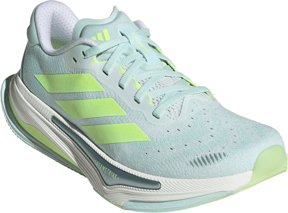 Light blue running shoe with green accents on a white background