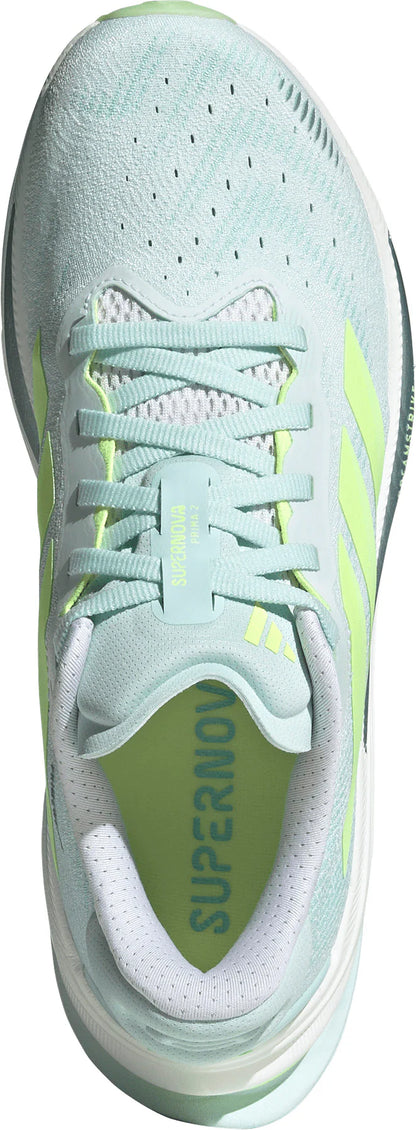 Light blue athletic shoe with green accents on a white background