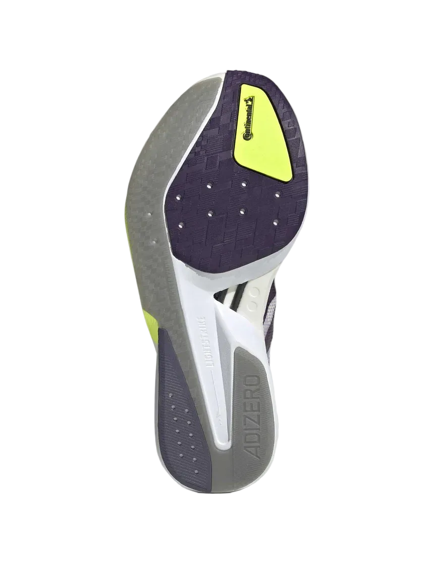 Close-up of a running shoe sole with a gray and purple design on a light gray background