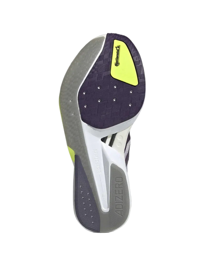 Close-up of a running shoe sole with a gray and purple design on a light gray background