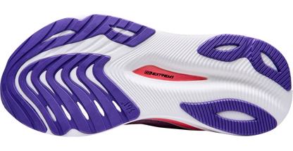 Close-up of a running shoe sole with purple and white pattern on a white background