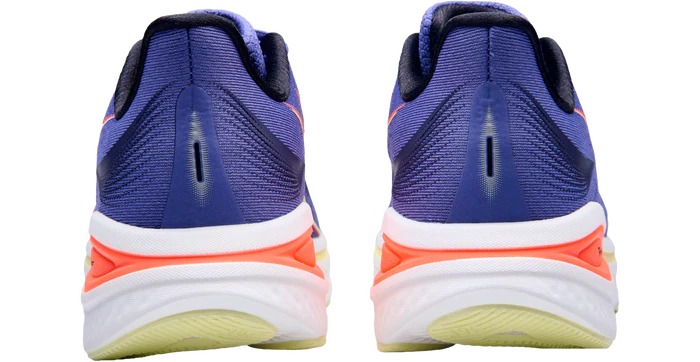 Blue running shoes with white and orange sole on a white background
