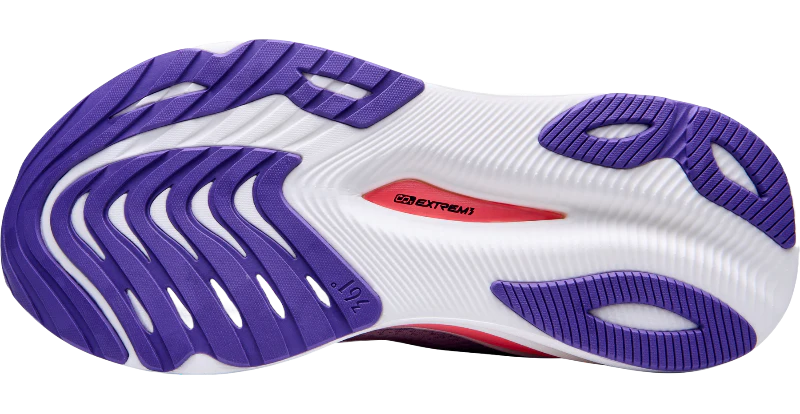 White running shoe with purple sole on a white background