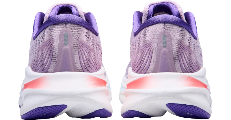 Purple running shoes with white soles on a white background