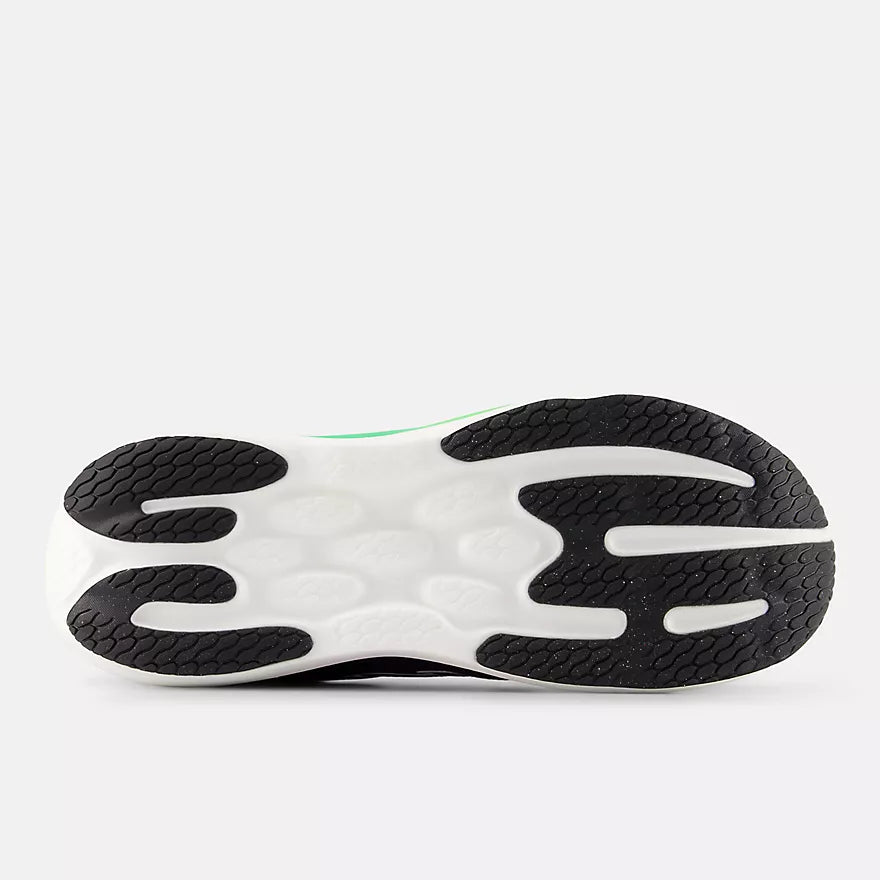 Close-up of a New Balance Men's 1080 v15 shoe sole with a white and black design on a light gray background