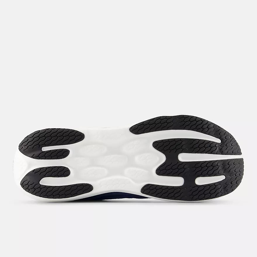 Close-up of a New Balance Men's 860 v15 shoe sole with a white and black design on a light gray background