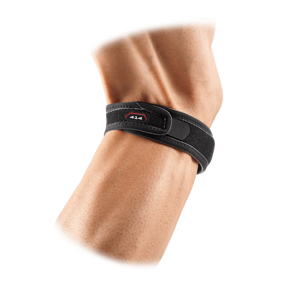 Black knee support on knee, rear view