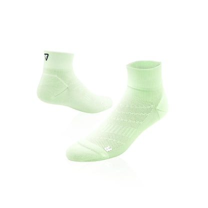 A pair of lime green athletic ankle socks displayed on a clean white background, with one sock standing upright and the other lying on its side to show the textured knit pattern.
