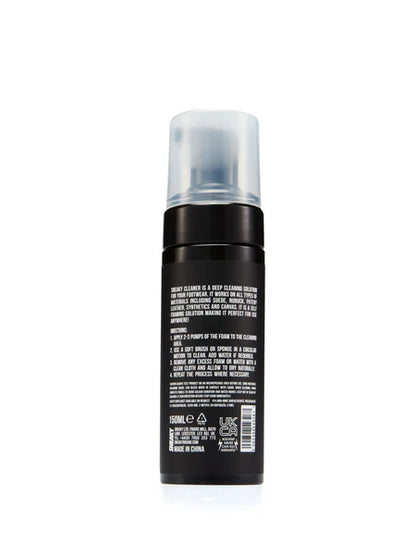 The back of a black aerosol can with a frosted clear cap, showing white text and a barcode on a white background.