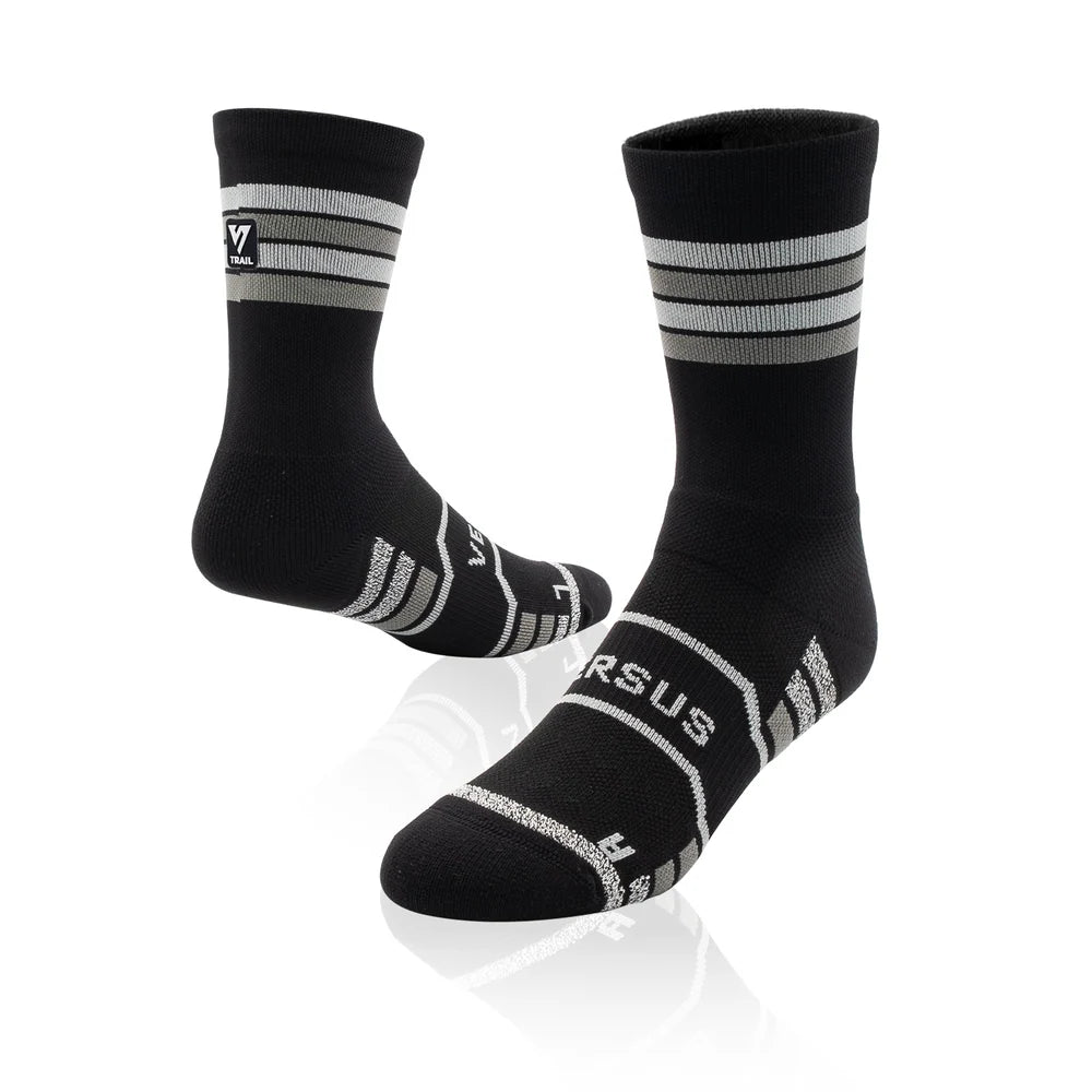 Black socks with white stripes and 'Versus' branding on a white background